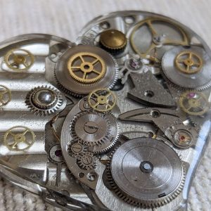 Steampunk brooch with watch gears
